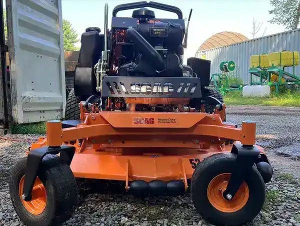 Commercial mower cutting a residential lawn
