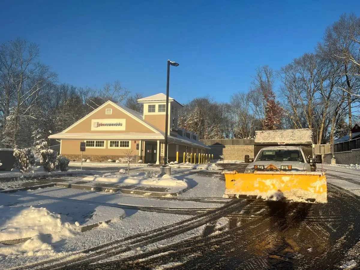 Commercial snow plowing with plow truck