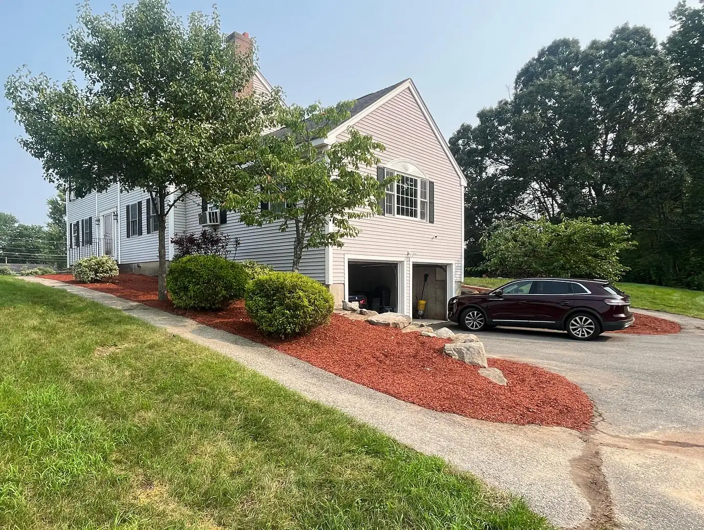 Weeding, pruning, and mulch installation - After